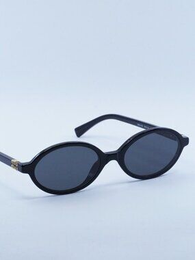 Miu Miu MU04ZS 1AB5S0 Sunglasses Black Oval Frame, Grey Lenses